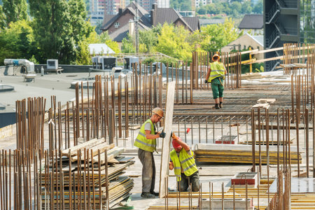 Kiev, Ukraine - August 9, 2019: New building under construction and construction site of a residential building. Concrete work is being performed at the site.のeditorial素材