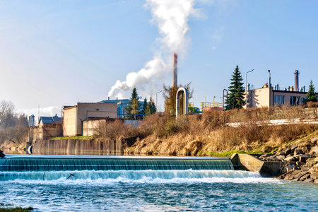 Industrial landscape with a sugar factory on the banks of the WisÅoka River in Jaslo, Poland.の写真素材