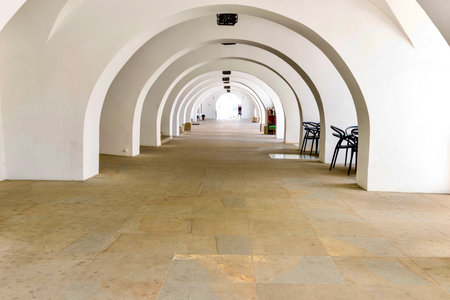 The market square is surrounded by architectural structures of different styles and eras. Restored buildings with beautiful arcade arches create a unique atmosphere.の写真素材