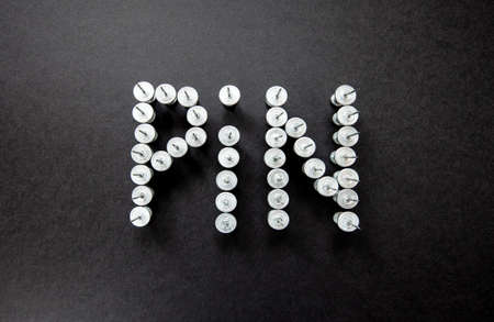 pins and stationery on a black background
