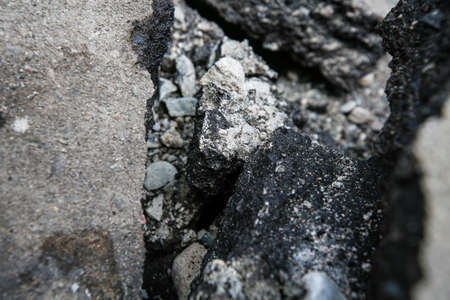 Repaving work. Asphalt pieces, pieces of broken asphalt, repairs, construction work