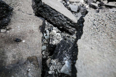 Repaving work. Asphalt pieces, pieces of broken asphalt, repairs, construction work