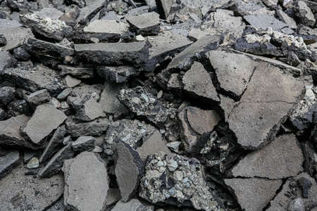 Repaving work. Asphalt pieces, pieces of broken asphalt, repairs, construction work