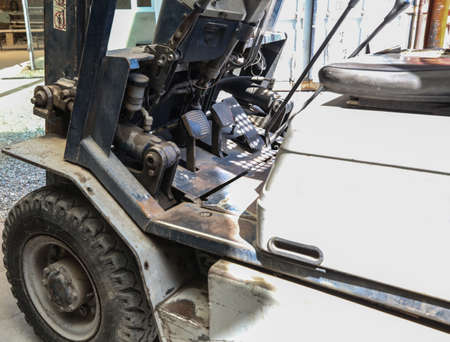 Electric forklift in warehouse from the inside, brake and gas pedalsの写真素材