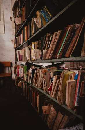 old library with shabby books at a village school