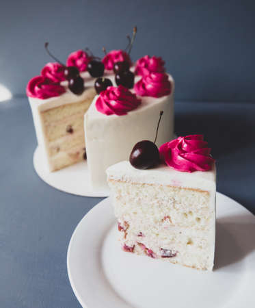 Mouth watering cherry cheesecake macro with fork. Shot on blue backgrondの写真素材