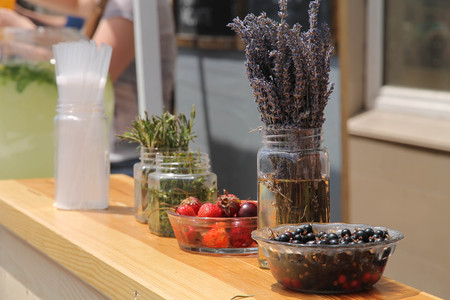 strawberry, currant and plum in platesの写真素材