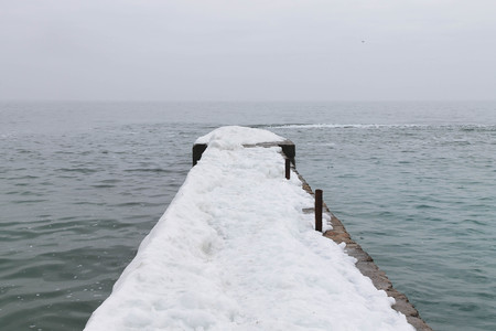 pier covered with snowの写真素材