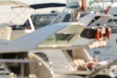 White yachts and lifebuoys. Marine theme. Soft focus.の写真素材