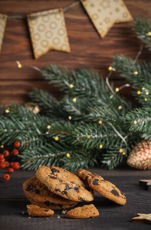 The cozy picture with cookies, spruce branch, lights and flags. Christmas mood.の写真素材