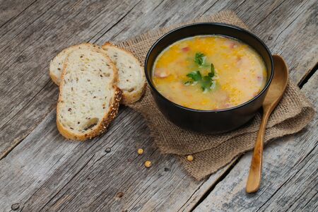 Delicious pea soup with smoked sausage.の写真素材