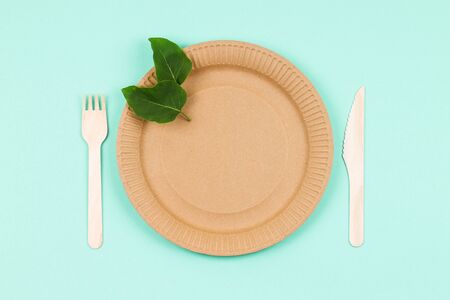 Wooden and paper utensils on a greenの写真素材
