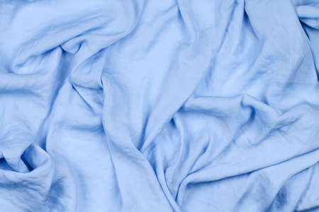 Delicate background with fabric spread out in waves. Fashion.の写真素材