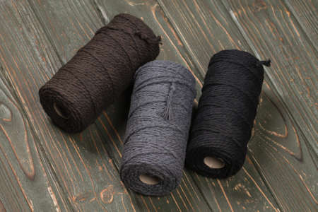 Three spools of cotton ropes of different colors. Handcraft.