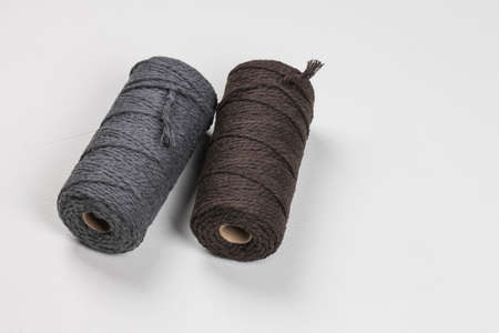 Two spools of cotton ropes of different colors. Handcraft.