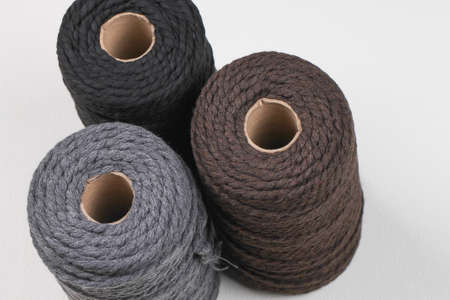 Three spools of cotton ropes of different colors. Handcraft.