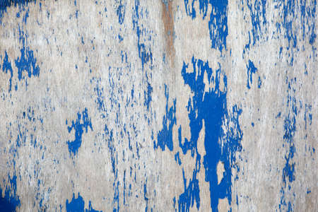 Weathered old wooden blue background, with the peeling paintの写真素材