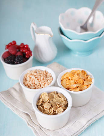 Variety of cereals on the blue wooden tableの写真素材