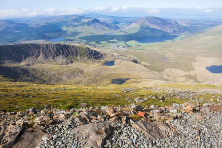 Track in Snowdonia National Park, North Wales, United Kingdom; view of the mountains and the lakes,...