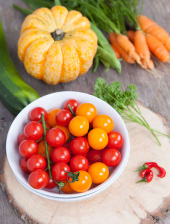 Autumn vegetables: tomatoes, carrots, pumpkin, runner beans, chiliesの写真素材
