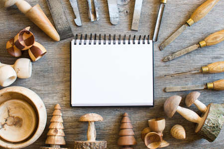 Old used chisels and wooden toys turned on the wood lathe, copy space for textの写真素材