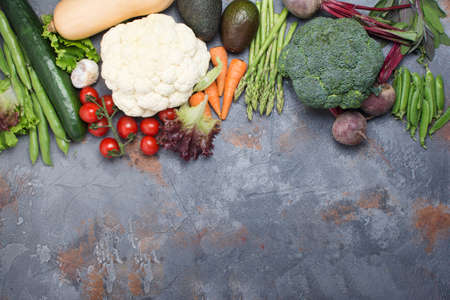 Top view of different vegetables and grains, arranged in a circle with copy space in the middle,...
