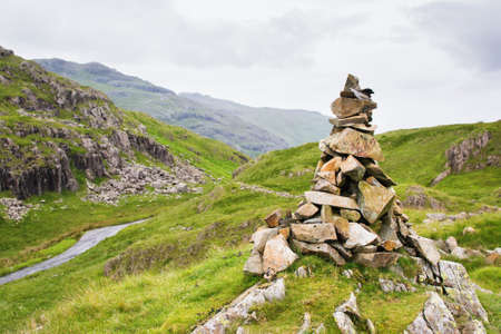 Views in Lake District National Park, England, built stone formation, mountains on the background, selective focusの写真素材