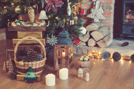 Christmas setting, decorated fireplace, fur treeの写真素材