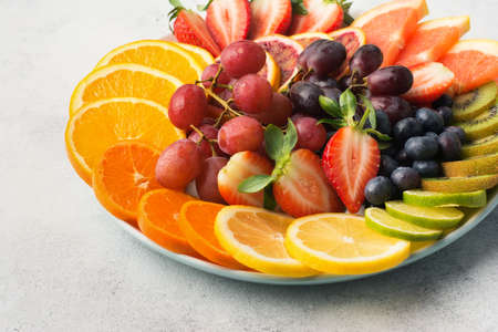 Top view of rainbow fruits and berriesの写真素材