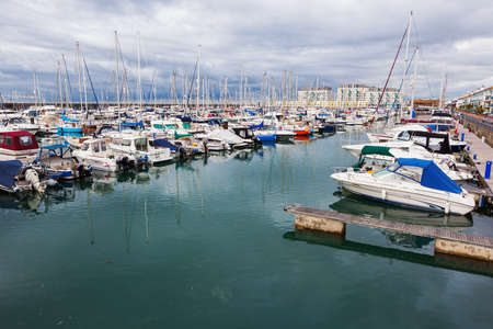 Photo for BRIGHTON, ENGLAND - SEPTEMBER 08 2018: Yachts and boats in Brighton Marina, East Sussex, UK, residential and leisure complex on September 08, 2018 - Royalty Free Image