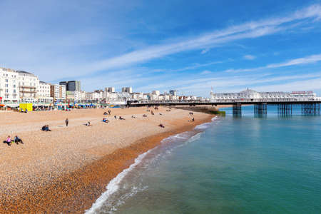 Brighton, England, October 07, 2018. VIew of the Brighton pier with blue sea and shingle beach, selective focusのeditorial素材