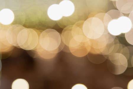 Abstract composition. Beautiful blurred Christmas interior , warm yellow lights, candles, toned