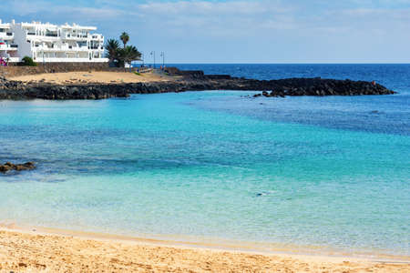 View of Playa Bastian beach in Costa Teguise, Lanzarote, Spain, clear turquoise waters, selective focusの写真素材