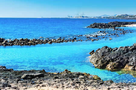Lagoon with turquoise clear water in Playa Jablillo beach, in Costa Teguise, Lanzarote, Canary...