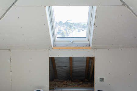 Loft extension in the house, plasterboarded walls and ceilings, roof window, unfinish conversion...