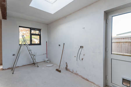 Brown plastered walls in the property, white painted background, selective focusの写真素材