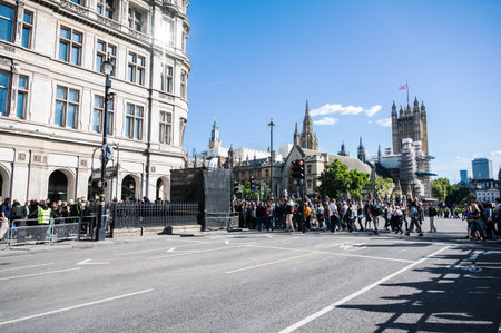 London, United Kingdom - September 17 2022: A crowd of people who came to pay respects to the Queen Elizabeth II. Queue of tourists walking towards Westminster Palace.のeditorial素材