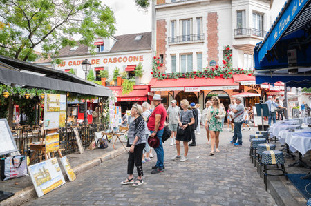 Paris, France - August 26 2022: People, artists, shops in Mormartre village, famous for its artistic heritageのeditorial素材