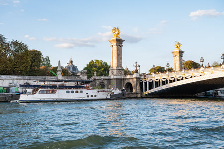 Paris, France - August 26 2022: Pont Alexandre III bridges on river Seine. Deck arch bridge connects the Champs-Elysees quarter with Invalides and Eiffel Towerのeditorial素材