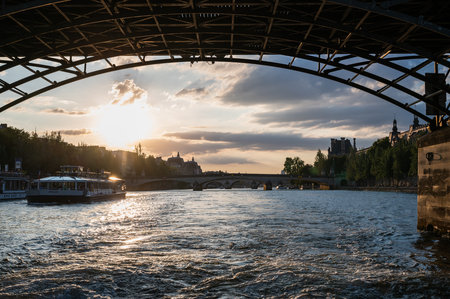 Paris, France - August 26 2022: Sunset at Bridge Pont des Arts, pedestrian bridge that has international reputation as the bridge of romance.のeditorial素材