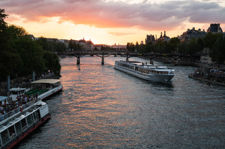 Paris, France - August 26 2022: Sunset at Bridge Pont des Arts, Paris, France, pedestrian bridge that has an international reputation as the bridge of romance.のeditorial素材