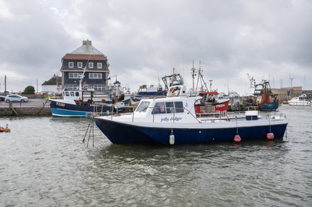 West Bay, United Kingdom - October 29 2022: Boats in West Bay harbour in Dorset, South West, United Kingdom, selective focusのeditorial素材