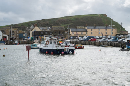 West Bay, United Kingdom - October 29 2022: Boats in West Bay harbour in Dorset, South West, United Kingdom, selective focusのeditorial素材
