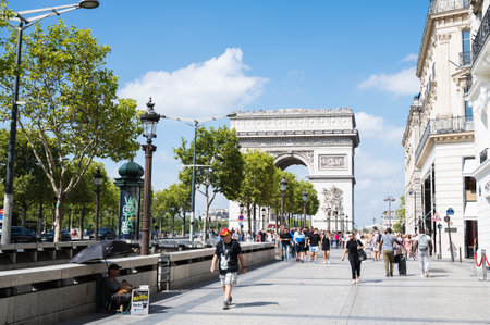 Paris, France - August 28 2022: Champs Elysees, avenue in the 8th arrondissement of Paris, runs from Place de la Concorde to the majestic Arc de Triomphe selective focusのeditorial素材