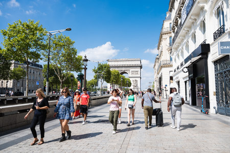 Paris, France - August 28 2022: Champs Elysees, avenue in the 8th arrondissement of Paris, runs from Place de la Concorde to the majestic Arc de Triomphe selective focusのeditorial素材