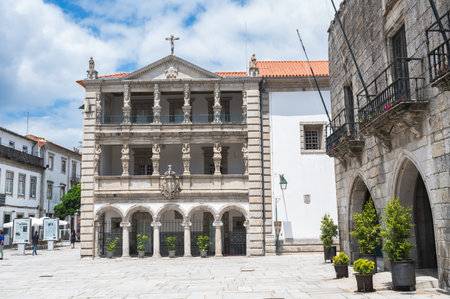 Viana do Castelo, Portugal - June 29 2023: People walking in Republic Square, view of House of Mercy and the Old Town Hall, selective focusのeditorial素材