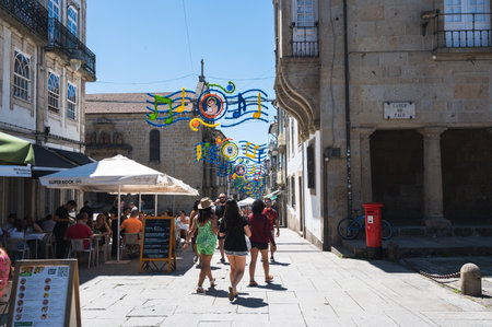 Braga, Portugal - June 30 2023: People walking in town centre in Braga, Northern Portugal, selective...