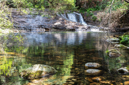 Pincho Waterfall near Viana do Castelo, Northern Portugal. View of the flowing water and beautiful lagoon, in the woodsの写真素材