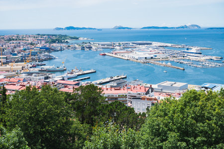 The view from the hill in Parque Monte del Castro, park located on a hill in Vigo, the biggest city in Galicia Region, in the North of Spain. View of the sea, harbour and docks, selective focusの写真素材