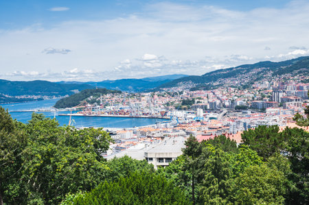 The view from the hill in Parque Monte del Castro, park located on a hill in Vigo, the biggest city in Galicia Region, in the North of Spain. View of the sea, houses and trees, selective focusの写真素材